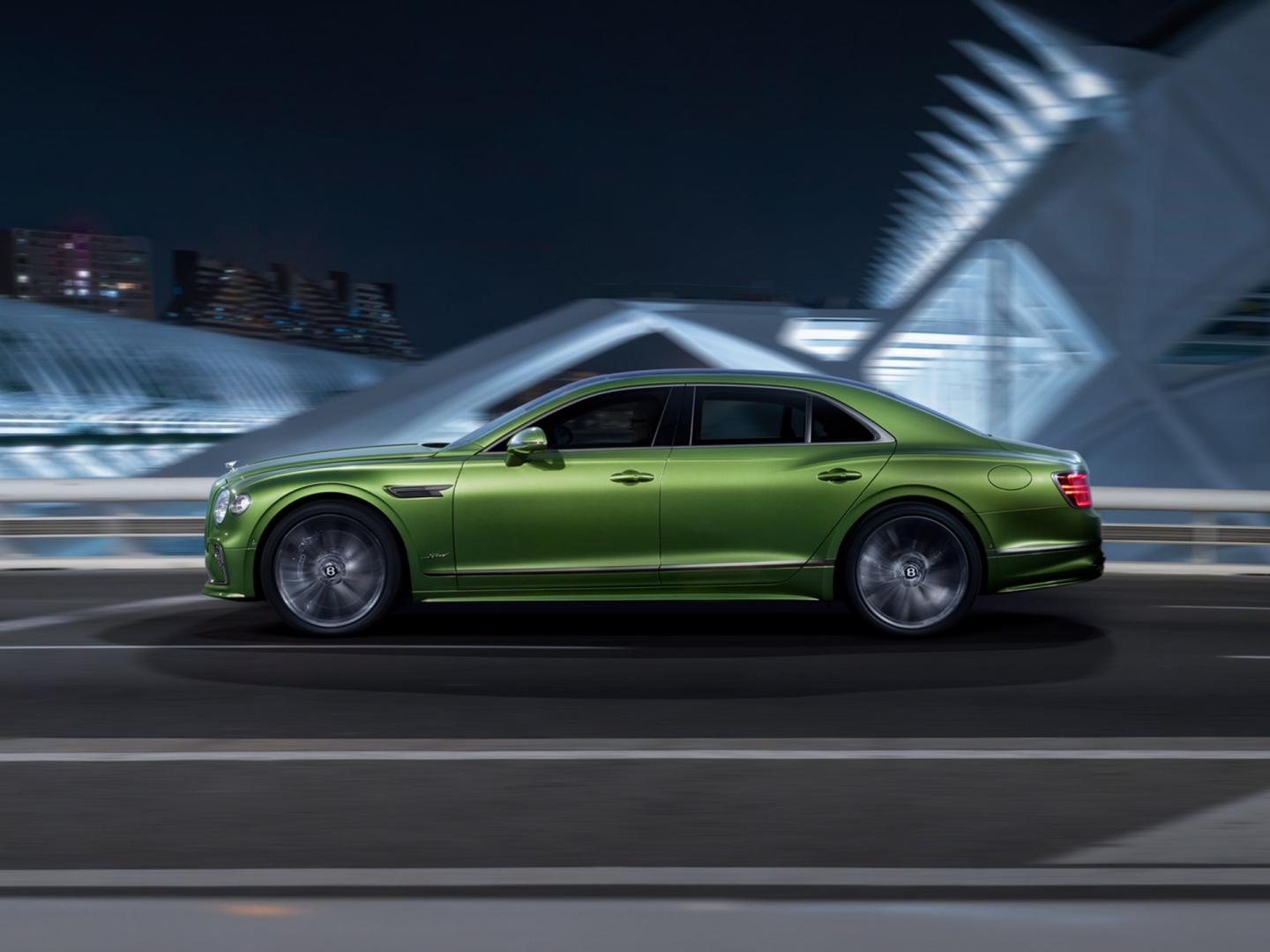 Front 3/4of new Bentley Flying Spur Speed in Tourmaline Green featuring new wheels