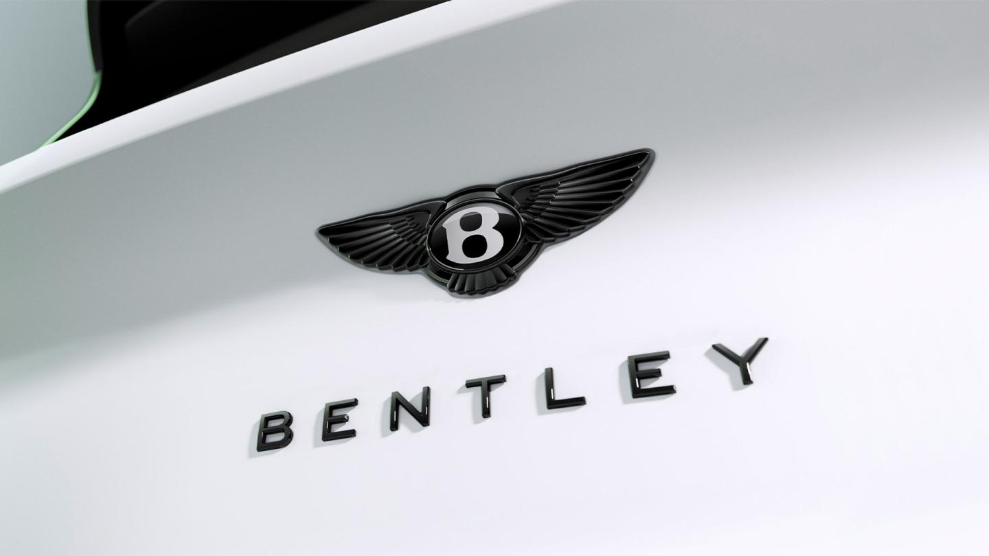 Close up of blacked out Bentley badge located at the rear of the vehicle.